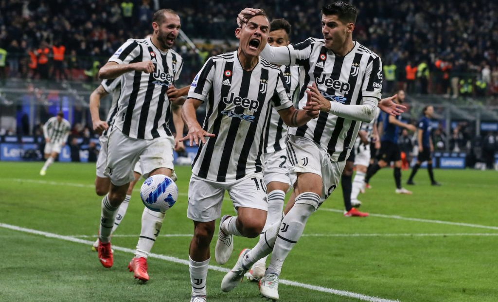 Milan, Italy, 24th October 2021. Paulo Dybala of Juventus celebrates with team mates after scoring a second half penalty